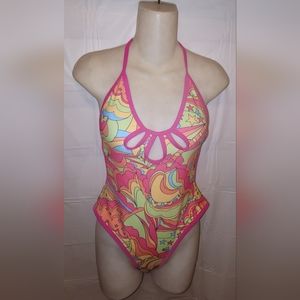 Beautiful NWOT retro monokini Size M padded,  adjustable ties peekaboo cutouts.
